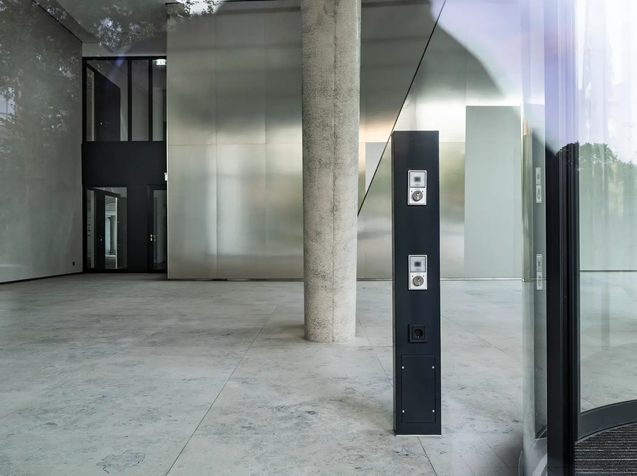 Interior view of ONE PLAZA with a light-flooded foyer.